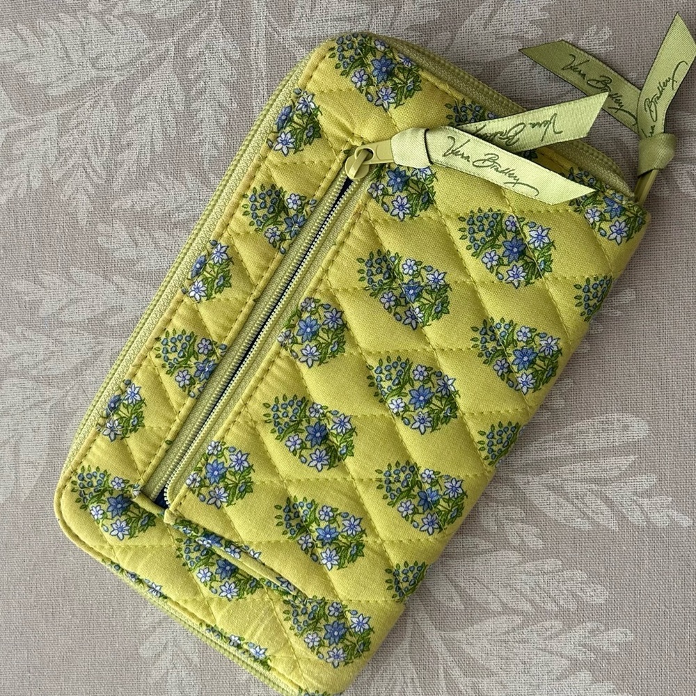Vera Bradley lime green zip wallet with pull out wrist strap good cond.